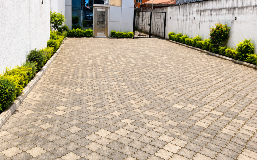Modern Courtyard Entrance Under Blue Skies 1 525x328