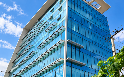 Modern Glass Office Under Blue Skies