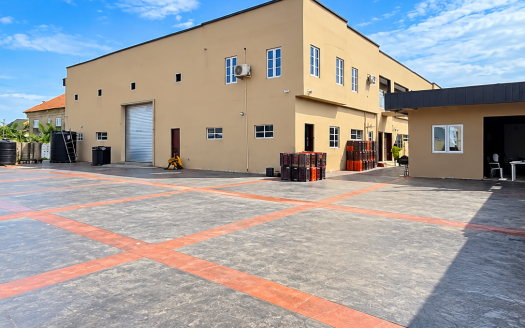 Sunlit Industrial Courtyard and Warehouse